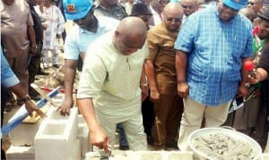 Rivers State Governor, Chief Nyesom  Wike (2nd left), laying the foundation stone of the second phase of Mile One Market in Port Harcourt, yesterday. With him are the Speaker, Rivers State  House of Assembly, Rt Hon Dabo Adams (2nd right) and Chairman, MCC, Senator John Mbata (right)