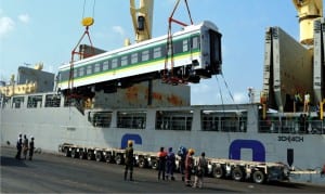 One of the 88 seater standard coaches for Abuja-Kaduna mass transit train services being offloaded from the ship at Apapa Port in Lagos, yesterday.