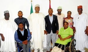 Senate President Bukola Saraki (3rd left), Senate Leader, Senator  Bala Ibn Na'allah (left), Deputy Chief Whip,  Senator Francis Alimikhana (right), Executive Director, Centre for Citizens With Disabilities, Mr David Anyaele (4th right) and other members of the centre  during their visit to the Senate President at the National Assembly in Abuja, yesterday.