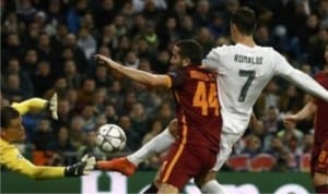Real Madrid’s Cristiano Ronaldo scoring his forth goal against AS Roma yesterday in their game at the Bernabeu in Madrid