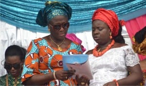 Rivers State Commissioner for Women Affairs, Barrister Ukel Oyaghiri (left), discussing a document with wife of Speaker, Rivers State House of Assembly, Mrs Charity Adams at the 2016 International Women Day celebration in Port Harcourt