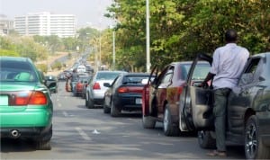 Motorists queuing to purchase petrol at a filling station on Olusegun Obasanjo way, Central Business District, as petrol scarcity continues in Abuja, recently 