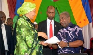 The MOSOP President, Mr Legborsi Piagbara (right) present his welcome address to the Hon Minister for Environment, Amina Muhammad (left) during her visit to Ogoni on Federal Government on clean-up of Ogoniland  recently.