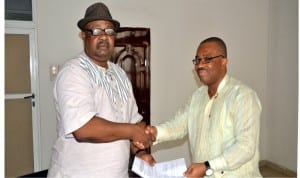 Former General Manager, Rivers State Newspaper Corporation, Mr Celestine Ogolo (right), handing over to his successor, Chief Soye Wilson-Jambo at the corporation, yesterday