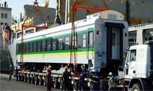 One of the 88 seated standard coaches for Abuja-Kaduna mass transit train services being offloaded from the ship at Apapa port  in Lagos last Thursday.