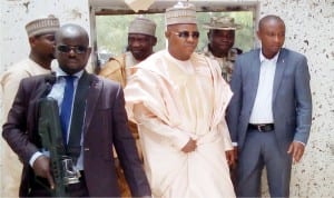 Gov. Kashim Shettima of  Borno inspecting the scene of suicide bombing at the Molai-umarari in Maiduguri on Wednesday.