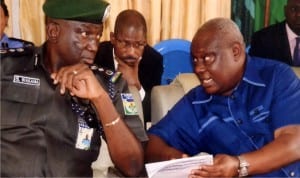 Deputy Inspector General of Police, Sotonye Wakama (left), in a chat with Resident Electoral Commissioner, INEC, Rivers State, Aniedi-Ikoiwak, during an accord meeting with politicians and candidates for the 19th March  rerun election on Wednesday in Port Harcourt.