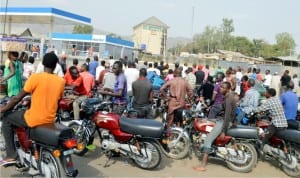 Commercial motorcyclists queuing to purchase  petrol at a filling station in Madalla, as scarcity  of the commodity continues in Niger, recently.