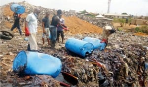 Expired raw materials extracts of malt and glucose owned by Guinness Nigeria Plc being destroyed at a dump site in Otta, Ogun State, recently.