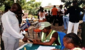 Independent National Electoral Commission official accrediting Hon (Dr) Farah Dagogo, Candidate PDP, Representing Degema Constituency 1 in Rivers State House of Assembly, during the re-run election at Ward 7 Unit