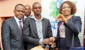 Regional Bank Head, Rivers, Bayelsa South Commercial, Mr Frank Anumele, branch leader Fidelity Uromi, Mr Joseph Ero, winner of 4 bedroom duplex in Fedelity Save 4 Shelter Promo, Mr Odianosen Adodo and Executive Director, South Bank, Mrs Aku Odinkemelu, during the presentation of the key to winner Mr Adodo in Port Harcourt, recently.
