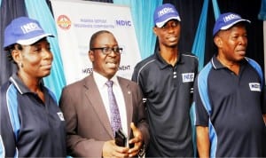 L-R: Principal Manager, Nigeria Deposit Insurance Corporation (NDIC), Mrs Pamela Roberts, Comptroller Enugu Zone, Mr Ayuba Ibrahim, Management Assistant, Mr Alfred Ijah and Assistant Director  Claims, Mr Aloysius Ezeoku, during a news conference on the activities of NDIC at the ongoing 27th Enugu International Trade Fair in Enugu on Tuesday.