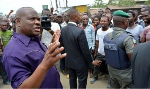 Rivers State Governor, Chief Nyesom Wike (left) , addressing people of Etche, during his inspection tour of on-going road reconstruction project at Etche-Chokocho Road in Etche Local Government of Rivers State recently