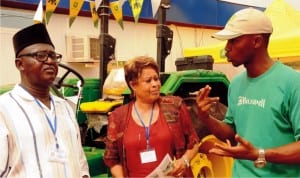 L-R: Council Member Enugu Chamber of Commerce, Industries, Mines and Agriculture (eccima), Mr Ndukwo Ogbuja, eccima Vice President Public Affairs, Lady Claire Asogwa and representative of Tata Africa, Mr Charles Ofoma, during eccima's visit to Tata Stand at the  ongoing 27th Enugu International Trade Fair in Enugu last Wednesday.