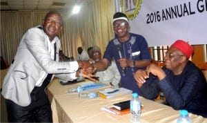 Managing Director, Ausari Farms Nigeria Ltd, Prof. Ahmed Ansari (left) having hand-shake with the Chairman of Agro Industrial Settlements Development Association of Nigeria (Asdan), Mr Rockson Essien during the first Annual General Meeting of Asdan in Abuja last Thursday. With them is the chairman of the occasion, Chief Guy Okechukwu