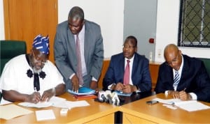 L-R: Minister of Communications, Mr Adebayo Shittu; Legal Adviser, Ministry of Communications, Mr Umar Abdullahi; Executive Vice Chairman, Nigerian Communications Commission (Ncc), Prof. Umar Danbatta and Executive Secretary, West African Telecommunications Regulatory Agency (Watra), Mr Ruffus Samuel during the signing of Mou between the Ministry of Communications and Watra in Abuja on Wednesday.