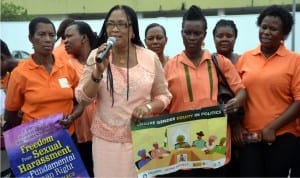 Permanent Secretary, Ministry of Women Affairs, Mrs Atosemi Teetito (2nd left),addressing NAWOJ membes during a peace walk to commemorate International Women’s Day in Port Harcourt.Photo: Ibioye Diama