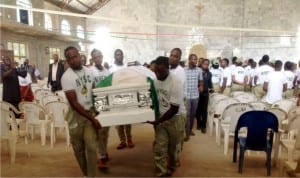 Nysc Corps members carrying the casket bearing the remains of their colleague, Chukwudumebi Okonta who was killed during the last Rivers rerun elections after a requiem mass at Holy Family Catholic Church Ajaji Illah, Oshimili North LGA, Delta State last Friday