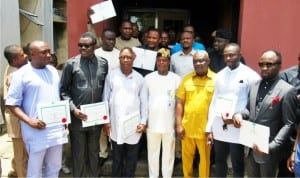 Cross Section of 11 members of the Rivers House of Assembly with the Resident Electoral Commissioner,Mr Aniedi Ikoiwak(middle) after receiving their Certificate of Return in Port Harcourt last Friday.