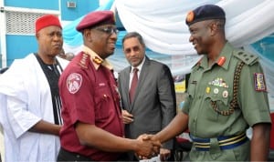 L-R: Manager Government And Business Relations, Mobil Producing Nigeria, Mr Nigel Cookey-gam; FRSC Corps Marshal, Boboye Oyeyemi and Representative of Secretary to Government of the Federation, Dr Ray Ugo, cutting a tape during the commencement of Pan Nigeria Road Safety Campaign in Abuja recently.