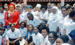 Wife of the Governor of Oyo State, Mrs Florence Ajimobi(left) in a group photograph with some of the ict graduands at the graduation of Florence Ajimobi  ict  centre in Ibadan last Friday.