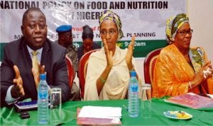 Director, Macroeconomic Analysis, Federal Ministry of Budget and National Planning (left) with Minister of State for Budget and National Planning, Mr Tunde Lawal, Hajia Zainab Ahmed at the National Stakeholders Dialogue on National Policy on Food and Nutrition in Abuja, recently.