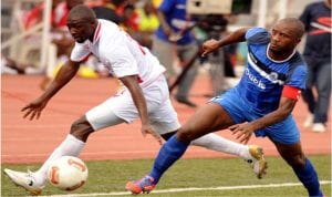 Enyimba captain, Chinedu Udoji (right) trying to stop an opponent in a match. He and his mates must be on their toes against Etoile du Sahel, today