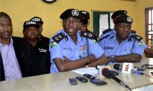 Commissioner of Police Rivers State Command, Mr Musa Kimo (middle) addressing journalists during a press briefing on recovery of cars, amununition of all kinds at Special Anti-Robbery Squad (SARS) office  Rukpokwu  in Obio/Akpor Local Government Area. With him are A. A. Muhammad  (right) and other SARS officer.                                                                                                                                                            Photo: Nwiueh Donatus Ken