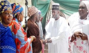 Sen. Abdul-Azeez Nyako of Adamawa Central Senatorial District (2nd-right), speaking to some women during the commencement of his Soft Loan Empowerment Programme for women petty traders in Yola on Sunday.