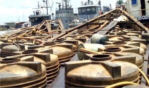Two Cotonou bound boats laden with products suspected to be illegally refined Automotive Gas Oil (Diesel Fuel) concealed in plastic tanks at the Warri Naval Base in Delta last Friday