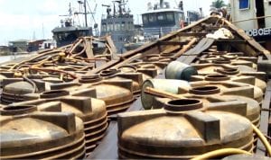 Two Cotonou bound boats laden with products suspected to be illegally refined Automotive Gas Oil (Diesel Fuel) concealed in plastic tanks at the Warri Naval Base in Delta last Friday 