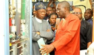 Minister for Information, Mr Lai Mohammed (left) with the General Manager, Integrated TV Service, Mr Rotimi  Salam, during the minister's inspection of NTA  digitisation  facilities in Jos recently.