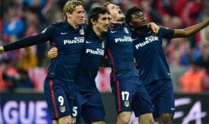 Atletico Madrid’s players celebrate winning the UEFA Champions League semi-final, second-leg football match between FC Bayern Munich and Atletico Madrid in Munich, Germany, yesterday