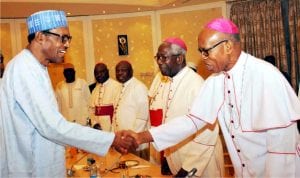 President Muhammadu Buhari (left) in a handshake with  Archbishop Anthony Obinna of Owerri Catholic Diocese during a meeting of the President with the leadership of Catholic Bishops' Conference of Nigeria at the Presidential Villa Abuja last Monday 