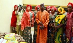 L-R: Mr Habila Kaura, Chief  of Ebba vilage, New Karu Nasarawa  State, Chief Yakubu Maikabila; West African Regional Director, United States Latino American Chamber of Commerce (Uslacc), Mrs Ifeoma Ejiogu and her husband, Mr Ejiogu, at the launch of Agriculture Youths Empowerment Programme in Ebba Village in Nasarawa  State last Monday