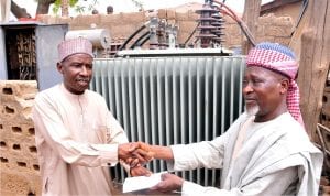 Representative of  Senator Shehu Sani, Alhaji Suleiman Ahmed (left), presenting 500kva transfomer  to the district Head of Badarawa Majalisa Kwaru, Alhaji Abdulhameed Giwa in Kaduna recently.