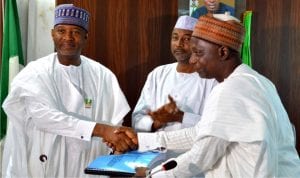 Minister of State for Transportation (Aviation), Senator Sirika Hadi (left), receiving from the Chairman, Committee on the Review and Amendment of Civil Aviation Acts 2016, Dr Ibrahim Idris,the committee's report in Abuja on Friday. With them is the Permanent Secretary in the Ministry, Mr Sabiu Zakari (middle).