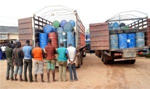 Men suspected to be diverting petroleum products arrested and paraded with their products by the Nigeria Security and Civil Defence Corps in Ibadan, recently.