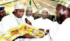 Governor Muhammed Abubakar of Bauchi State (left), presenting relief materials  to Chairman, Bauchi Local Government Area, Alhaji Ado Aska, during the commencement of distribution of Federal Government’s relief materials to Idps in Bauchi State on Monday