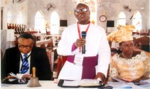 Bishop, Diocese of Okrika/Synod President, Rt. Revd. Tubokosemie R. Abere (middle), reading a presidential address, during the 1st session of the 5th Synod at Bethel Anglican Church, Amadi-Ama, Okrika North Archdeaconry recently. With him are the Chancellor, Diocese of Okrika, His Lordship Justice Sika Henry Aprioku (left) and the wife of the Bishop, Diocese of Okrika, Mrs Zipporah T. Abere Photo: Egberi A. Sampson 