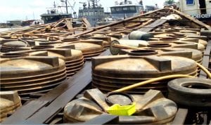 Two Cotonou bound boats laden with products suspected to be illegally refined *Automotive Gas Oil* (Diesel ) concealed in plastic tanks at the Warri Naval Base in Delta recently.