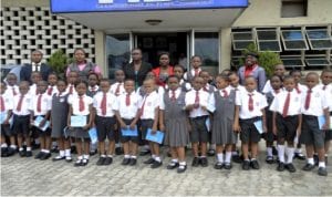 Pupils of Ash-Merlyn International School, Port Harcourt, in a group photograph, during an excursion visit to Rivers State Newspapers Corporation, publishers of The Tide newspapers in Port Harcourt, yesterday Photo: Ibioye Diama