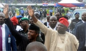 Vice President, Yemi Osinbajo (left) and Governor Akinwunmi Ambode of Lagos State (right), acknowledging cheers from the crowd on arrival, at Tafawa Balewa Square, venue for the inauguration of some security equipment, during the working visit of the Vice President to Lagos State as representative of President Muhammadu Buhari on Monday.