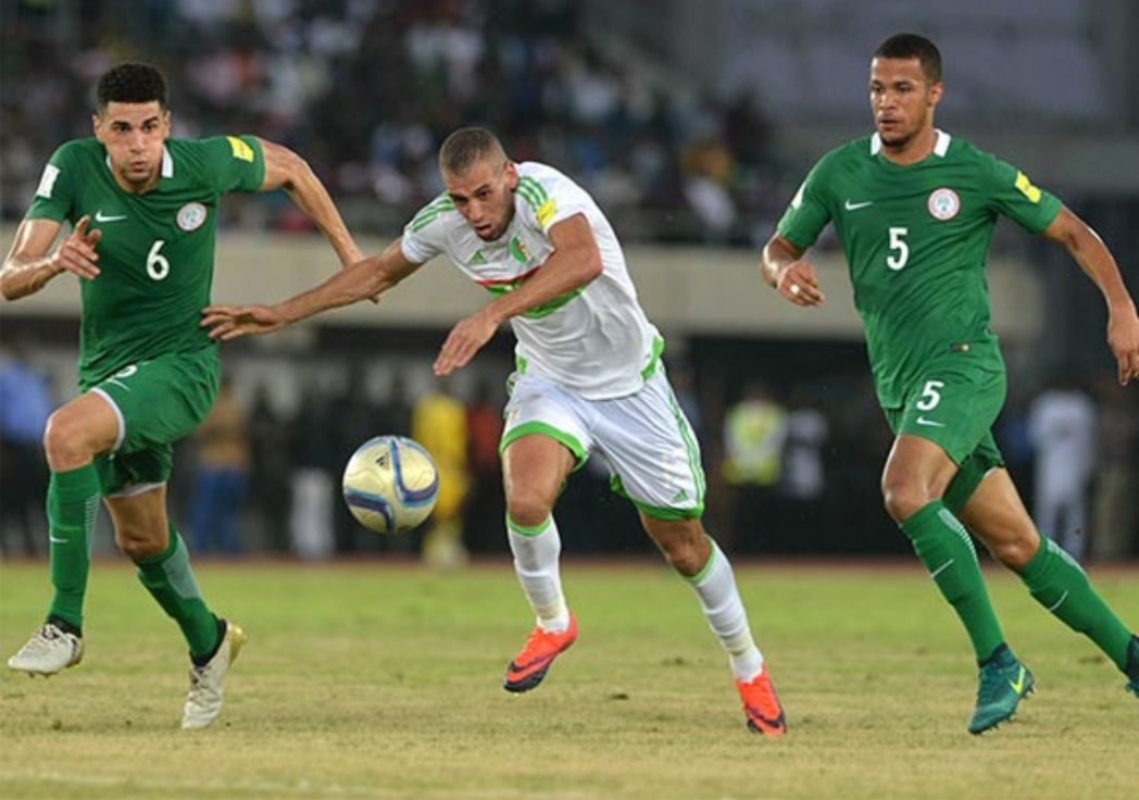 Super Eagles defender Leon Balogun (6) and Troost Ekong (5) closing in on Algerian attacker when both teams met in their final Russia 2018 qualifier, last Friday.